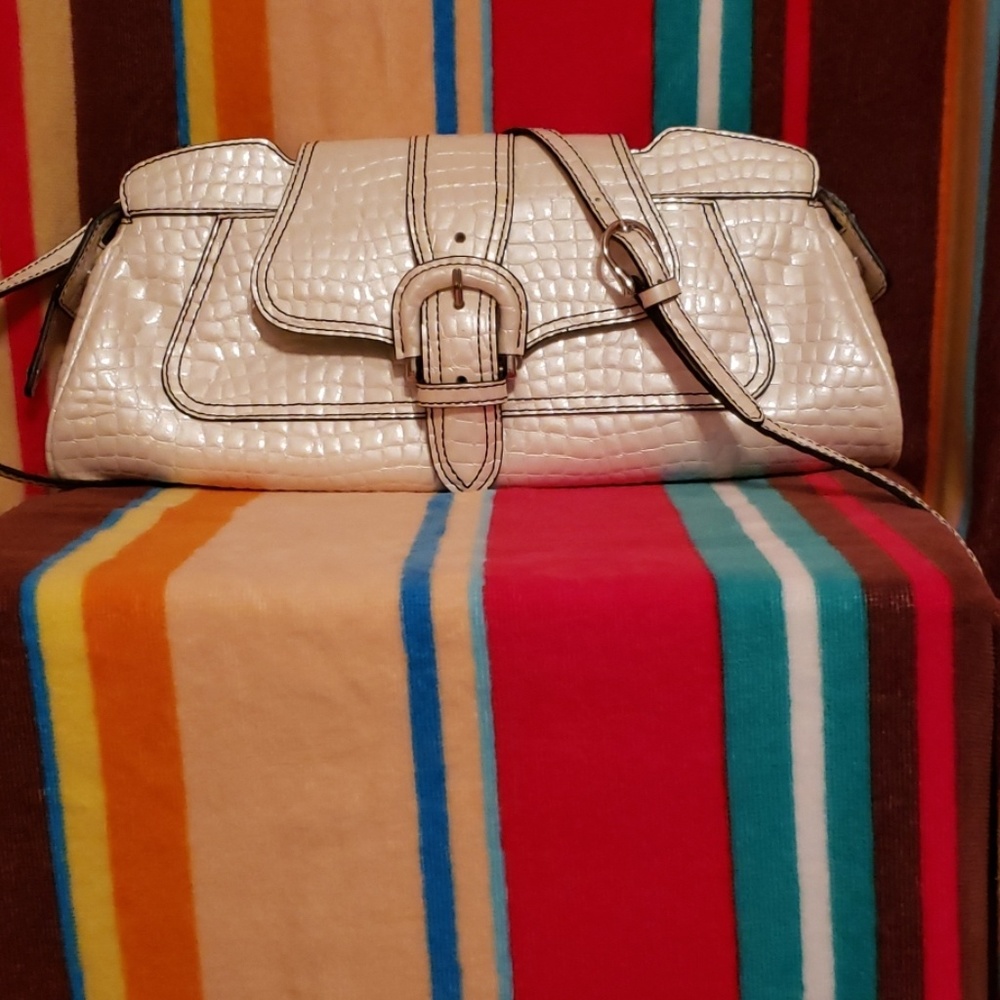 MAXX NEW YORK.   Convertible cuteness in a bag!